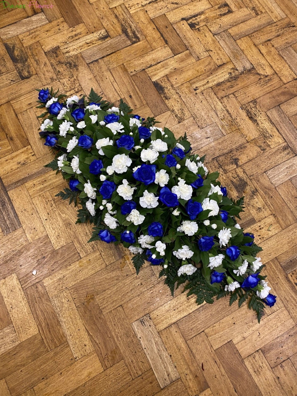 Blue Rose and white carnation Coffin Spray